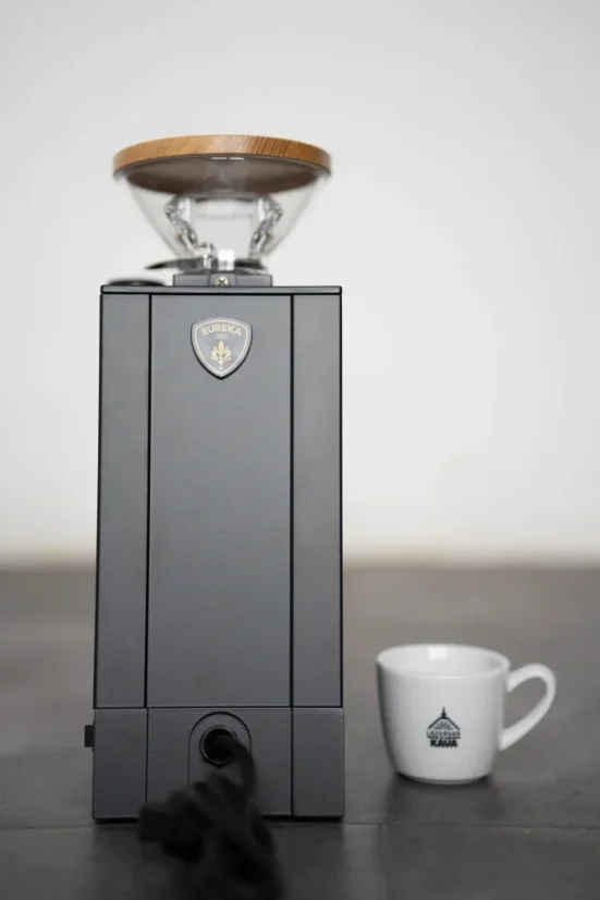 Rear view of the Eureka Single Dose grinder with coffee beans.