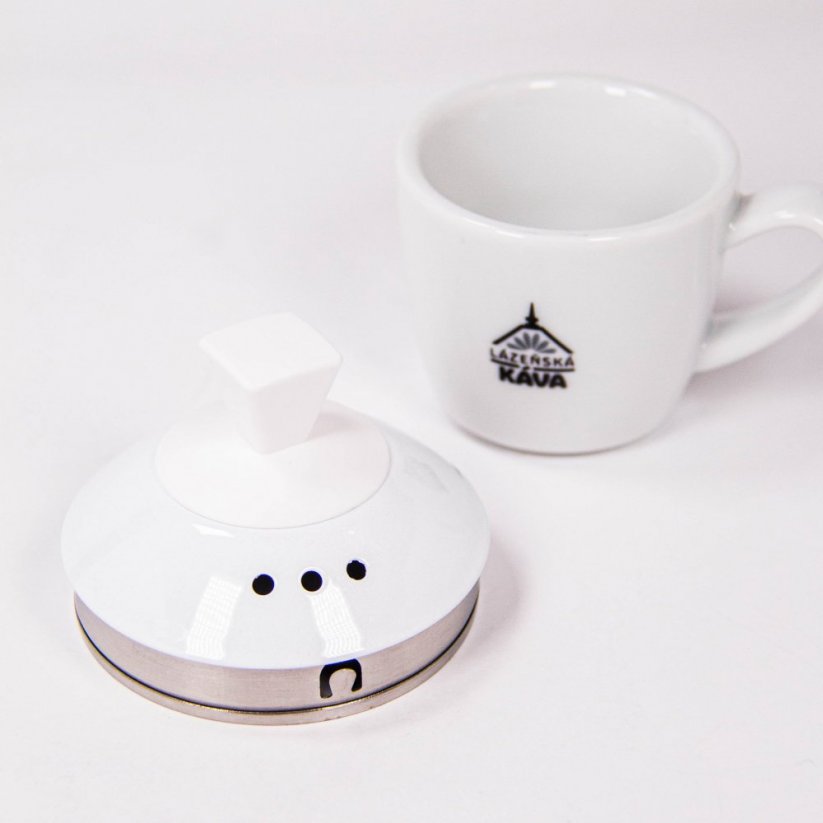 A teapot lid and a coffee cup.
