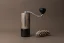 Manual Comandante grinder in Virginia Walnut color on a brown background.