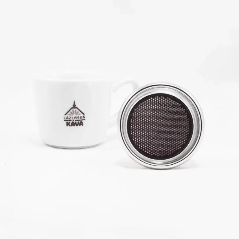 IMS silver basket on a white background with a cup, view of the bottom part of the basket.