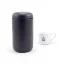Insulated mug viewed from the front with coffee in the background.