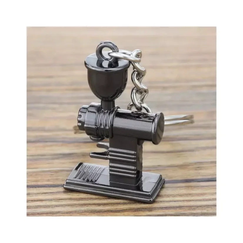 Un moulin noir en porte-clés est un cadeau idéal pour les amateurs de café, qui complétera parfaitement votre anneau de clés avec sa couleur noire élégante.