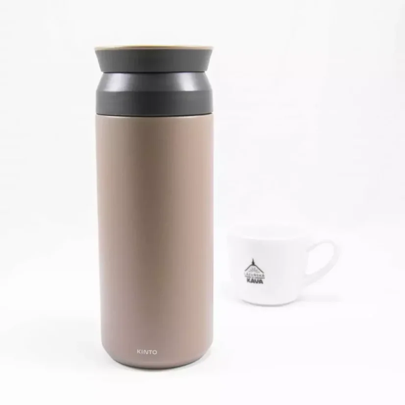 Khaki 500 ml Kino Travel Tumbler thermos with a white cup of coffee in the background