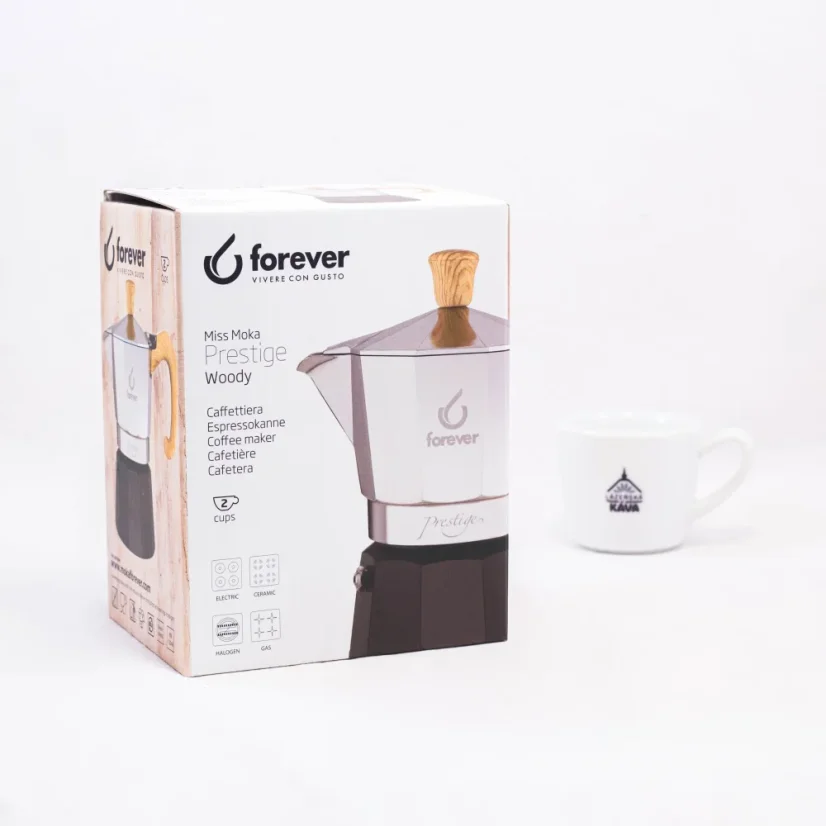 Original packaging of Forever Miss Moka Woody coffee pot with a cup of coffee in the background.