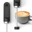 Subminimal NanoFoamer Lithium milk frother in detail with a cup of coffee