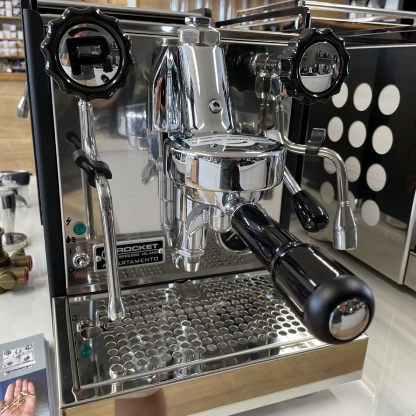Black and white Rocket Espresso Appartamento lever coffee machine, ideal for use in households.