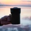 Black Trinity Zero cup-top coffee brewer with prepared coffee.