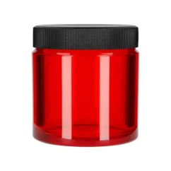Red coffee storage container by Comandante, ideal for preserving the freshness of coffee beans.