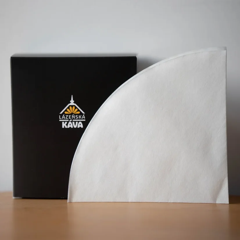 Paper filters for brewing coffee using a Chemex, with a box featuring the logo.