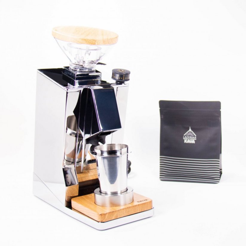 Eureka electric grinder in silver, next to the Spa coffee package