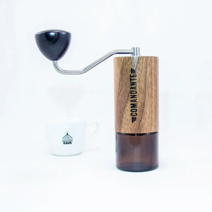 Hand-operated Comandante C40 MK4 Nitro Virginia Walnut coffee grinder with elegant glass elements.