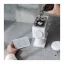 Whole bean coffee and the grind setting of the Fellow Ode grinder in white color