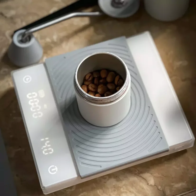 White digital scale for baristas for preparing filtered coffee.