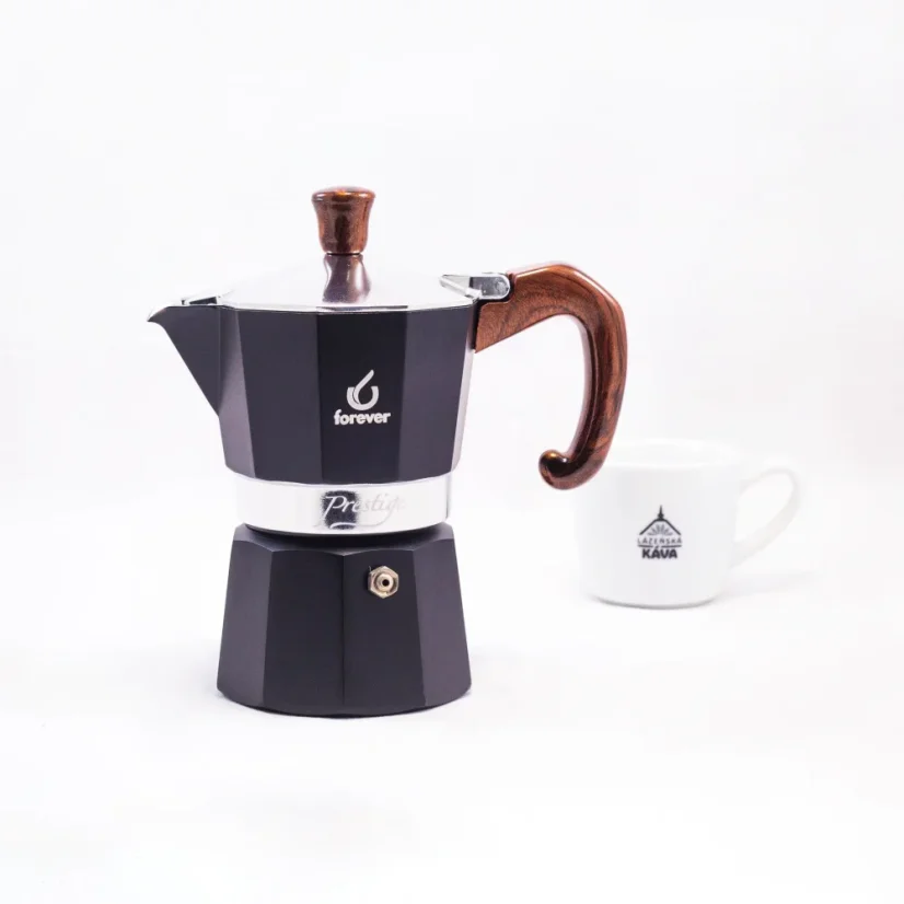 Moka pot with a cup of coffee
