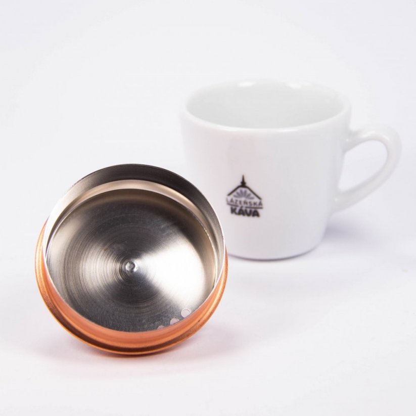 The lid of a Hario Buono copper teapot with a gooseneck.