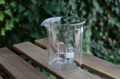 Low glass pitcher, 400 ml capacity, for outdoor seating.