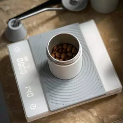 White digital scale for baristas for preparing filtered coffee.
