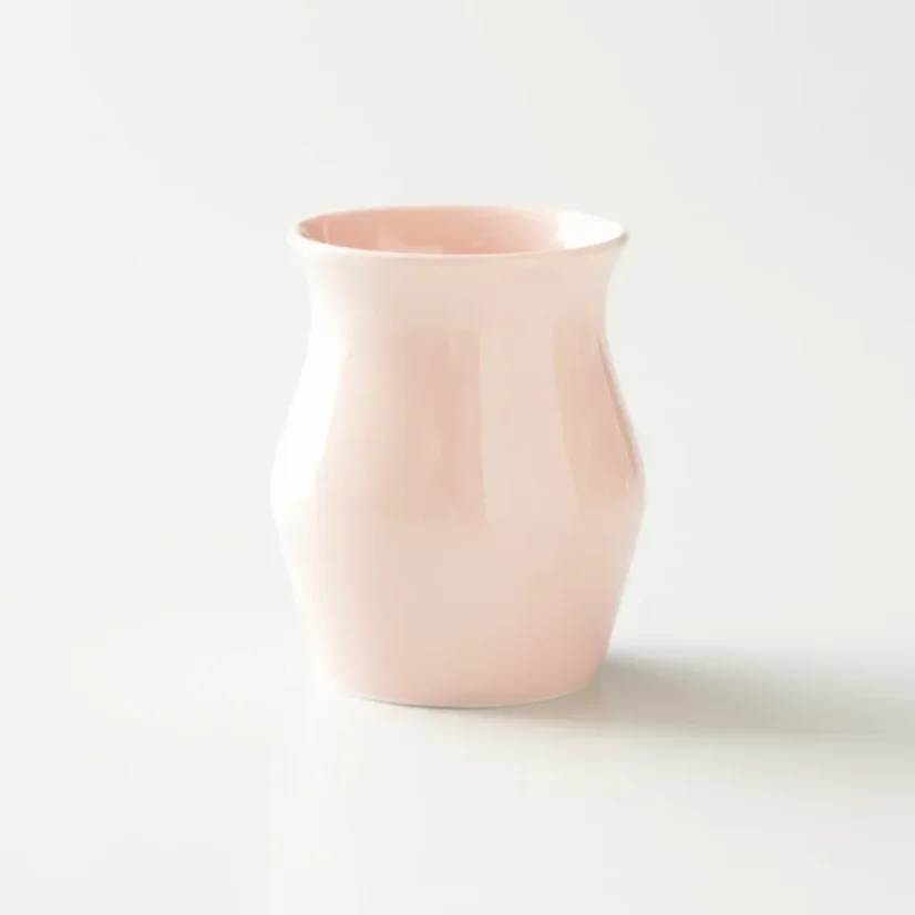 Sinnbecher in rosa aus Porzellan.