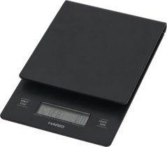 Schwaarz digital Kichewaag mat engem LCD-Display a zwee Bedéngungsknäppercher op de Säiten. Schwaarz digital Kichewaag mat engem LCD-Display a zwee Bedéngungsknäppercher op de Säiten.