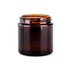 Glass brown coffee container by Comandante, ideal for storing freshly ground coffee.