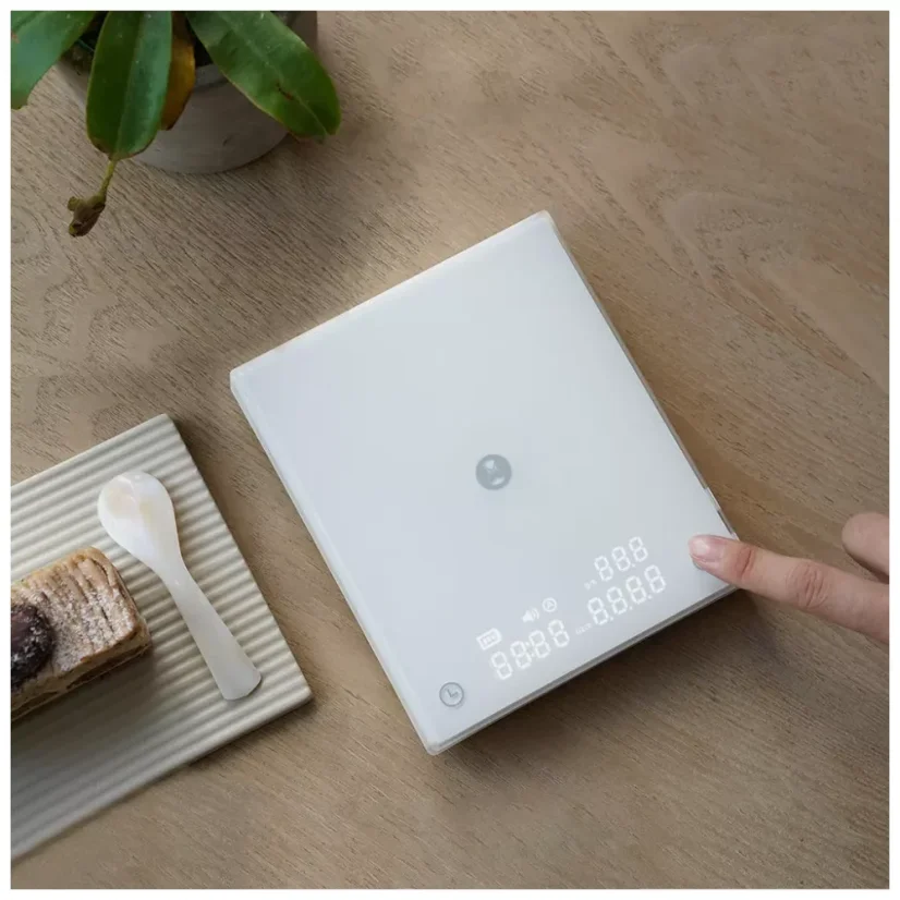 White digital scale for baristas for brewing filtered coffee.