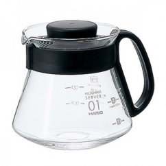 Hario glass server with black grip for coffee preparation.