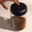 Transparent container for coffee and tea with a capacity of 1200 ml and a black lid.