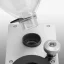 Placement of the hopper for coffee beans on the copper Rocket Espresso FAUSTINO grinder