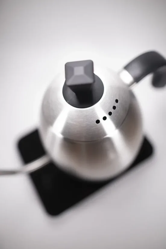 Brewista Smart Pour silver electric kettle with a black handle, top view