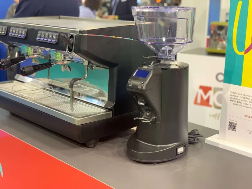 Black Nuova Simonelli MDXS CORE espresso grinder with adjustable dosing.