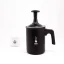 Milk frother in black by Bialetti Tuttocrema with a capacity of 166ml on a white background accompanied by a white cup with a coffee logo.