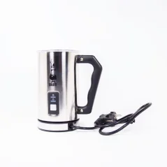 The image shows an electric milk frother by Bialetti. It is a modern kitchen appliance in black and silver, designed for making velvety milk foam.