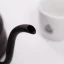 Black goose-neck kettle Hario Buono with a capacity of 1.2 liters, suitable for induction heating. Black goose-neck kettle Hario Buono with a capacity of 1.2 liters, suitable for induction heating.