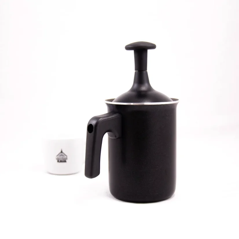 Black Bialetti Tuttocrema milk frother with a 166ml capacity viewed from the back on a white background, accompanied by a cup with a coffee logo.