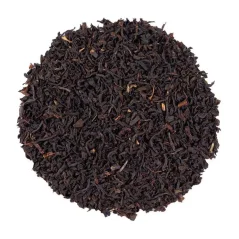 Loose black tea English Breakfast Broken on a white background, top view Loose black tea English Breakfast Broken on a white background, top view
