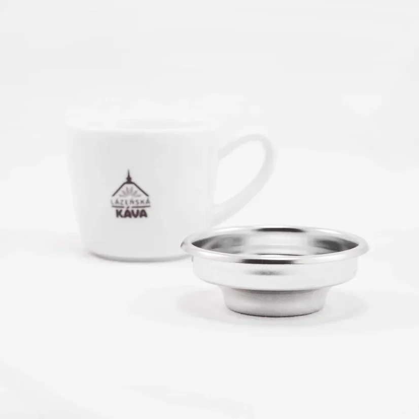 IMS silver basket on a white background with a cup; Portafilter baskets