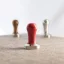 Lelit tampers in red, brown, and silver colors. Lelit tampers in red, brown, and silver colors.