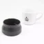 Detail of the lid of the Kino Travel Tumbler Khaki 500ml with a porcelain cup in the background