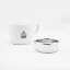 IMS silver basket on a white background with a cup; Portafilter baskets