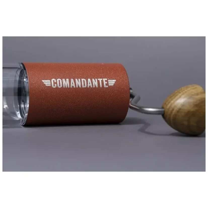 Detailed photo of a red manual coffee grinder.