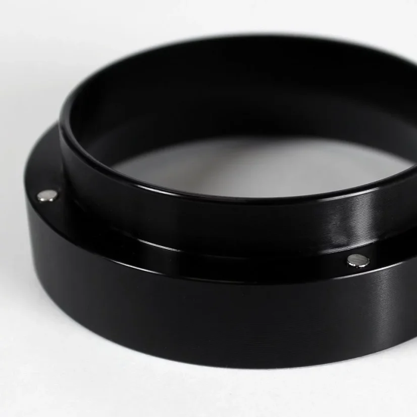 Black dosing funnel 58 mm for precise coffee dosing.