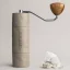 Manual coffee grinder Comandante X25 Trailmaster with 39 mm grinding stones, perfect for preparing perfectly ground coffee.