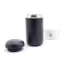 Detail of travel mug parts with coffee in the background