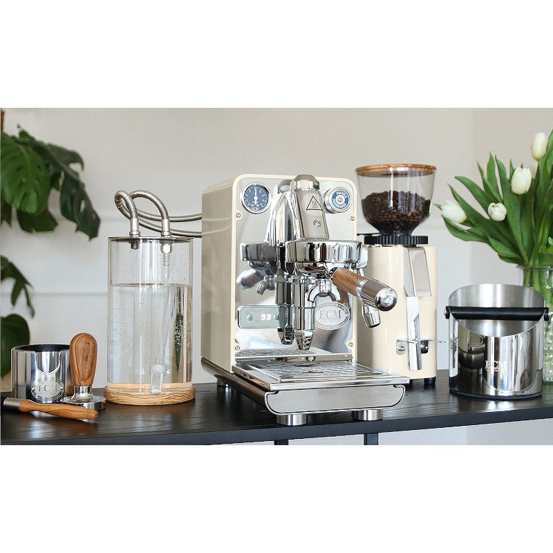 ECM Puristika PID Olive home lever coffee machine on the kitchen counter.