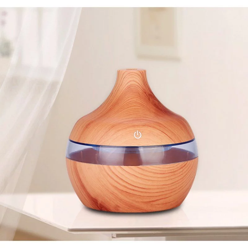 Wooden electric aroma diffuser in the shape of a volcano.