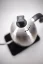 Brewista Smart Pour silver electric kettle with a black handle, top view