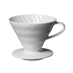White ceramic Hario V60-02 dripper against a light background