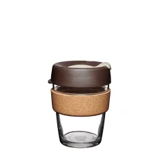 Glass thermal mug with brown lid and cork holder