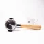 Naked 58 mm portafilter with olive wood handle and a coffee cup. Naked 58 mm portafilter with olive wood handle and a coffee cup.