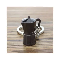 Ein Schlüsselanhänger in Form einer schwarzen Moka-Kanne ist das perfekte Geschenk für Kaffeeliebhaber, das Ihren Schlüsseln einen stilvollen Farbton und ein individuelles Aussehen verleiht.